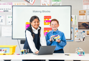 A photo showing two students in a modern classroom learning about the wonders of STEM